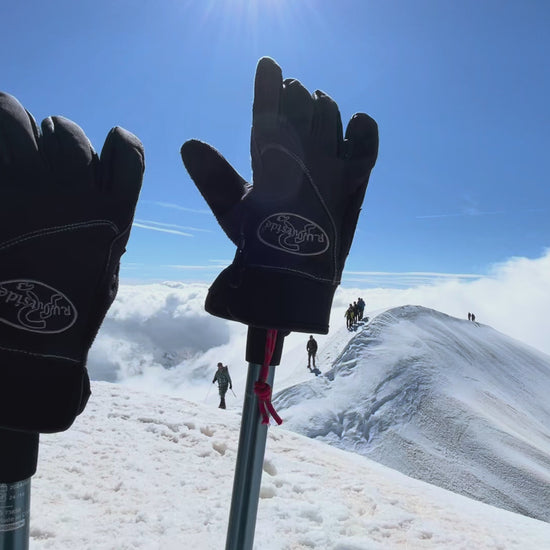 R.U. Outside winter gloves on ski poles outside on mountain