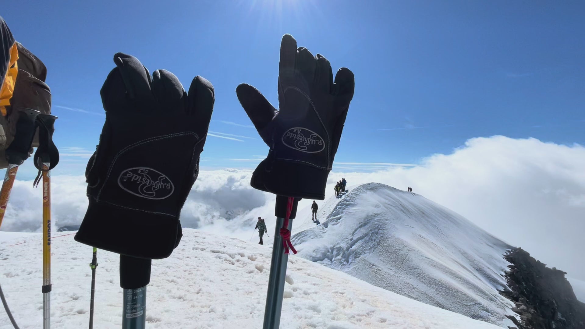 R.U. Outside winter gloves on ski poles outside on mountain